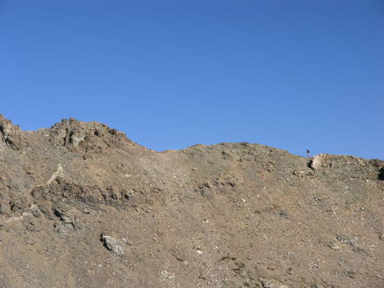 A hiker ascends Kelso Ridge towards Torreys Peak
